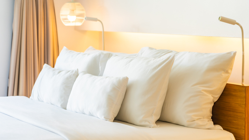 White pillow and blanket on bed decoration interior of bedroom